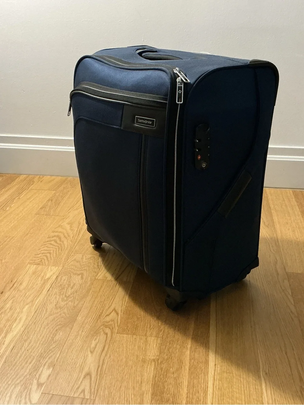 Samsonite Optimum softside spinner carry-on suitcase.
